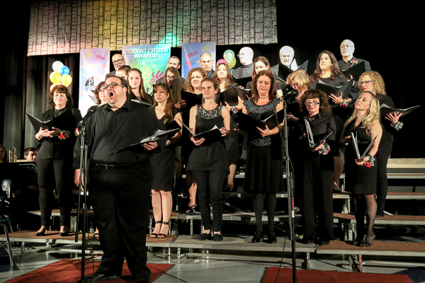 A Group of Students in Black Singing Choir
